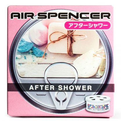 Air Spencer car air freshener in 'After Shower' scent, featuring packaging with a soothing assortment of bath items and soaps, paired with a white canister with a blue grid design.