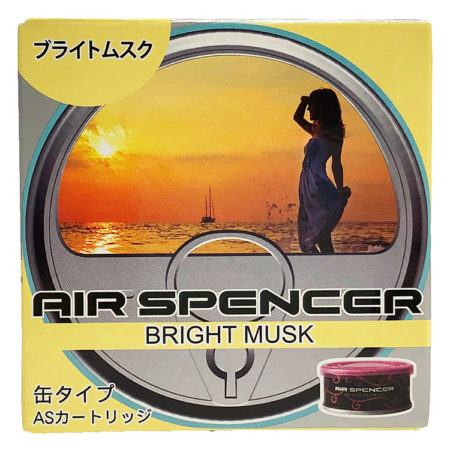 Packaging for Air Spencer car air freshener in 'Bright Musk' scent, featuring a silhouette of a woman against a sunset over the ocean, with a pink canister displayed in the corner