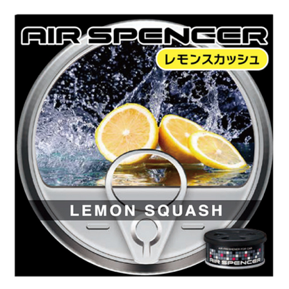 Air Spencer car air freshener with 'Lemon Squash' scent, depicting fresh lemon slices splashing in water, accompanied by a black canister with a colorful grid pattern